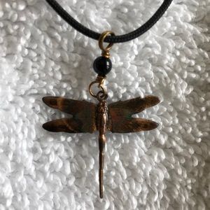 Beautiful copper dragonfly necklace.